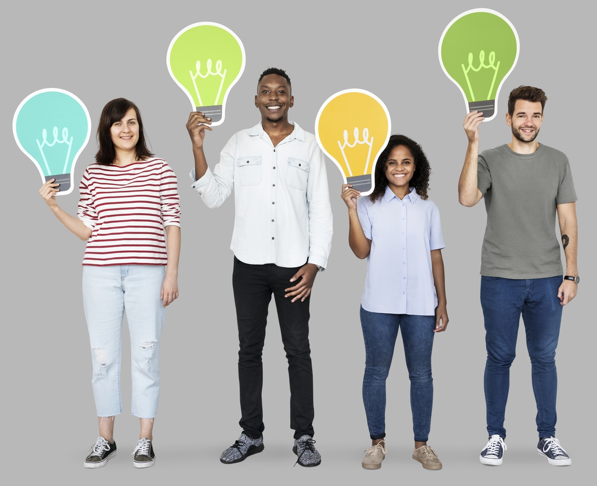 Four people holding lightbulb images to indicate they are thinking.